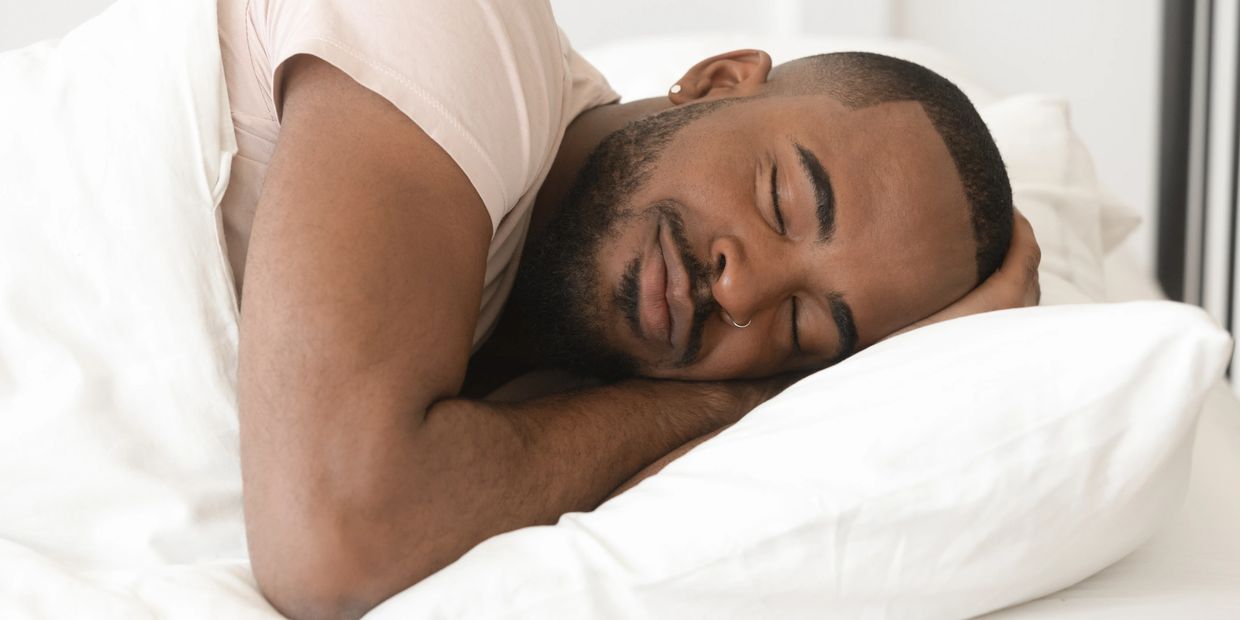 Man sleeping in bed 