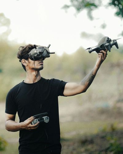 Man holding FPV drone