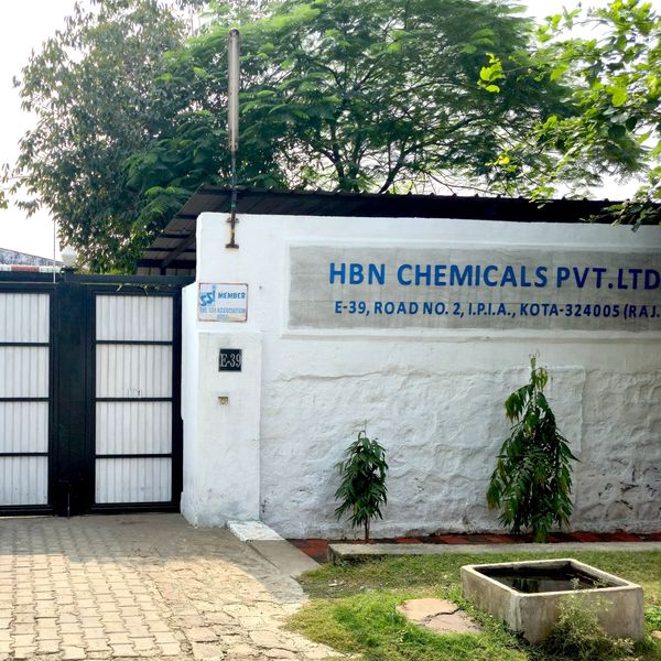Entrance gate of HBN Chemicals Pvt. Ltd. with greenery.