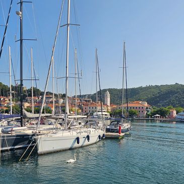 A fleet of charter sailboats docked in Trogir, Croatia