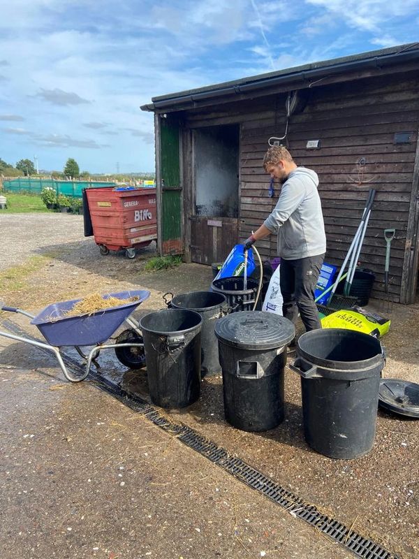 A man preparing animal feed