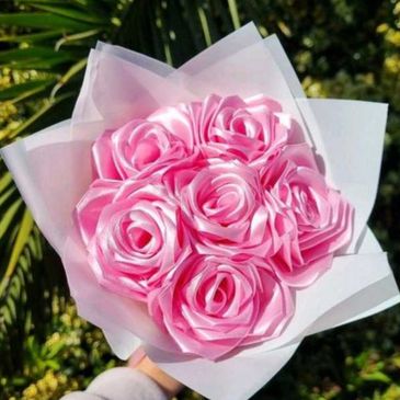 A bouquet of beautifully crafted pink ribbon roses.