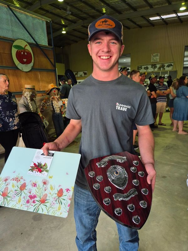Ethan Flood at the Stanthorpe Show 2026, receiving John Pfrunder Memorial Trophy for the champion tr