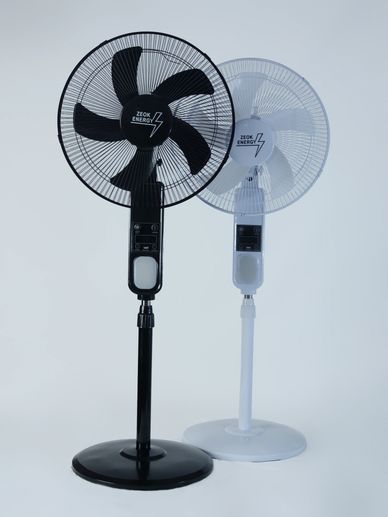 Two standing fans, one black and one white, with ZEOK ENERGY branding.