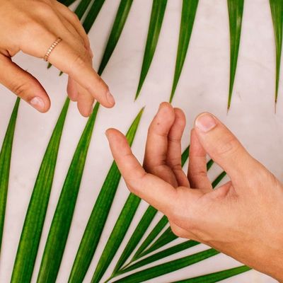 Two hands showing the exchange of energy for an online tarot reading 
