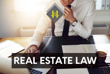 real estate lawyer reviewing documents, providing expert guidance for a seamless transcation