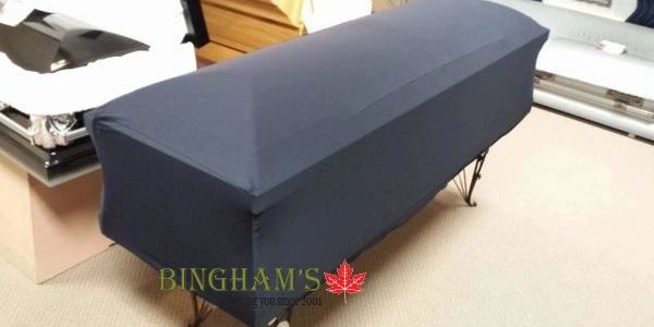 Black casket cover on a coffin in a funeral home.