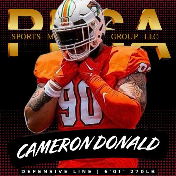 Football player Cameron Donald in orange uniform preparing for game.
