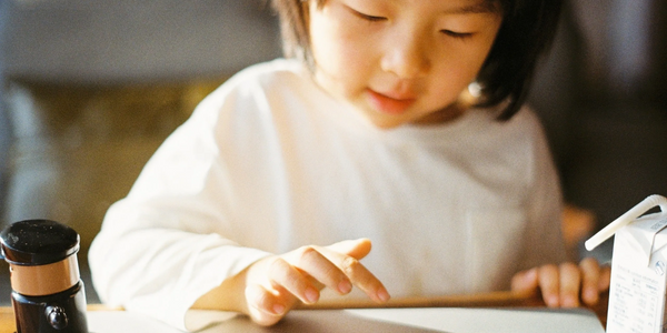 Image of a child using a tablet device.