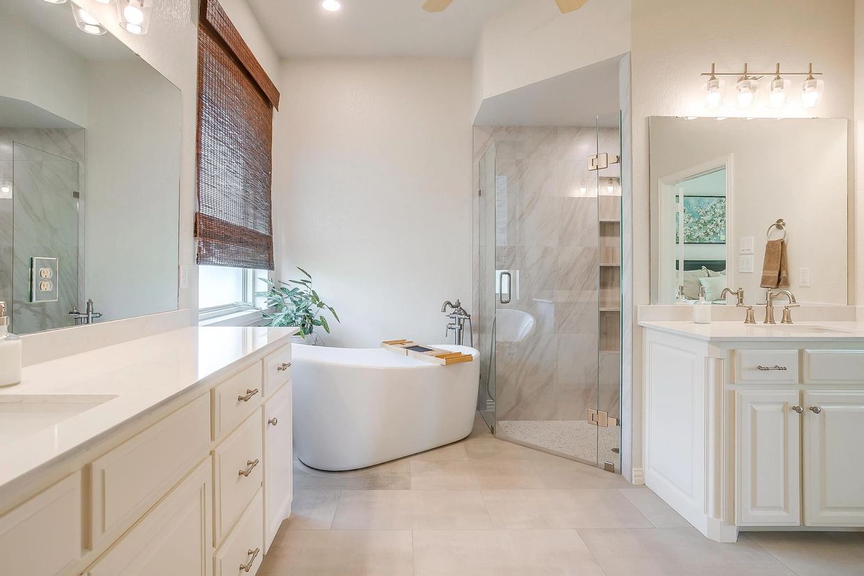 2.5 Ac home with a remodeled master bath featuring a garden tub with white cabinets in Haslet, TX.