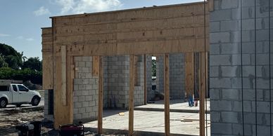 Wood and concrete frame at building construction site.