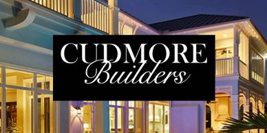 Luxury house with Cudmore Builders logo.