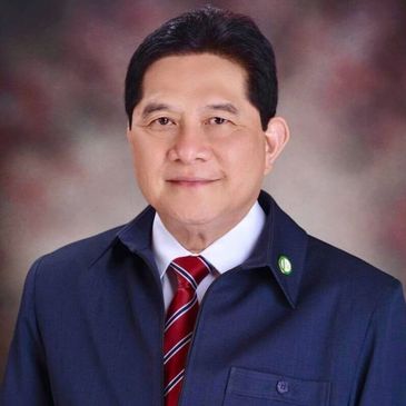 Professional portrait of a man in a suit with a striped tie.
