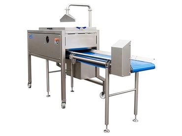 Industrial food processing conveyor with metal detector and blue belt.