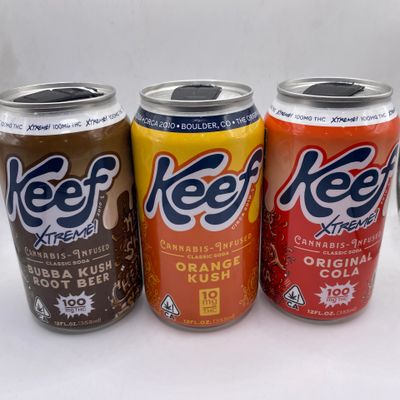 Three cans of Keef Xtreme cannabis-infused sodas in different flavors.