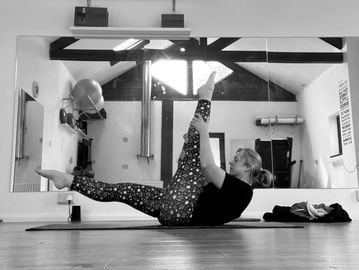 Pilates Single Straight Leg Stretch in Studio