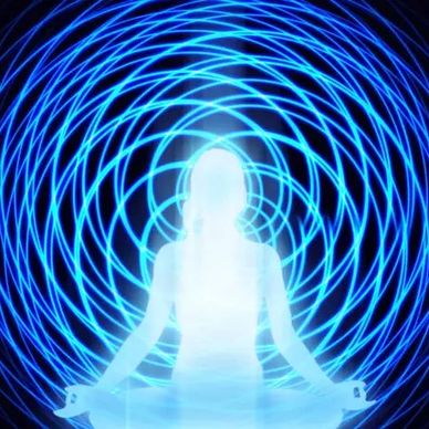 Silhouette meditating with glowing blue spirals.