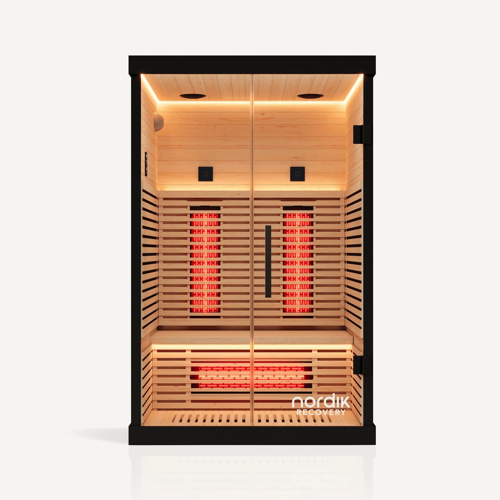 Modern wooden sauna with glowing infrared panels and sleek black frame.