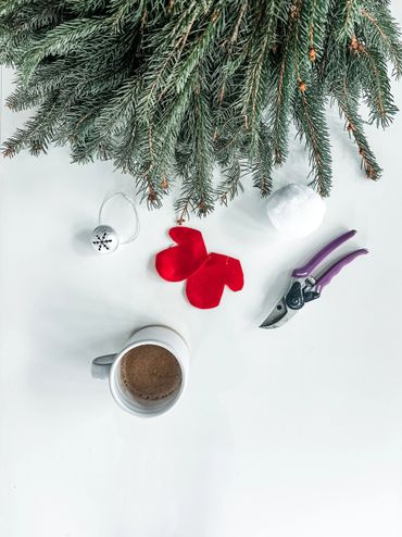 A picture of gnome, coffee mug and plier 