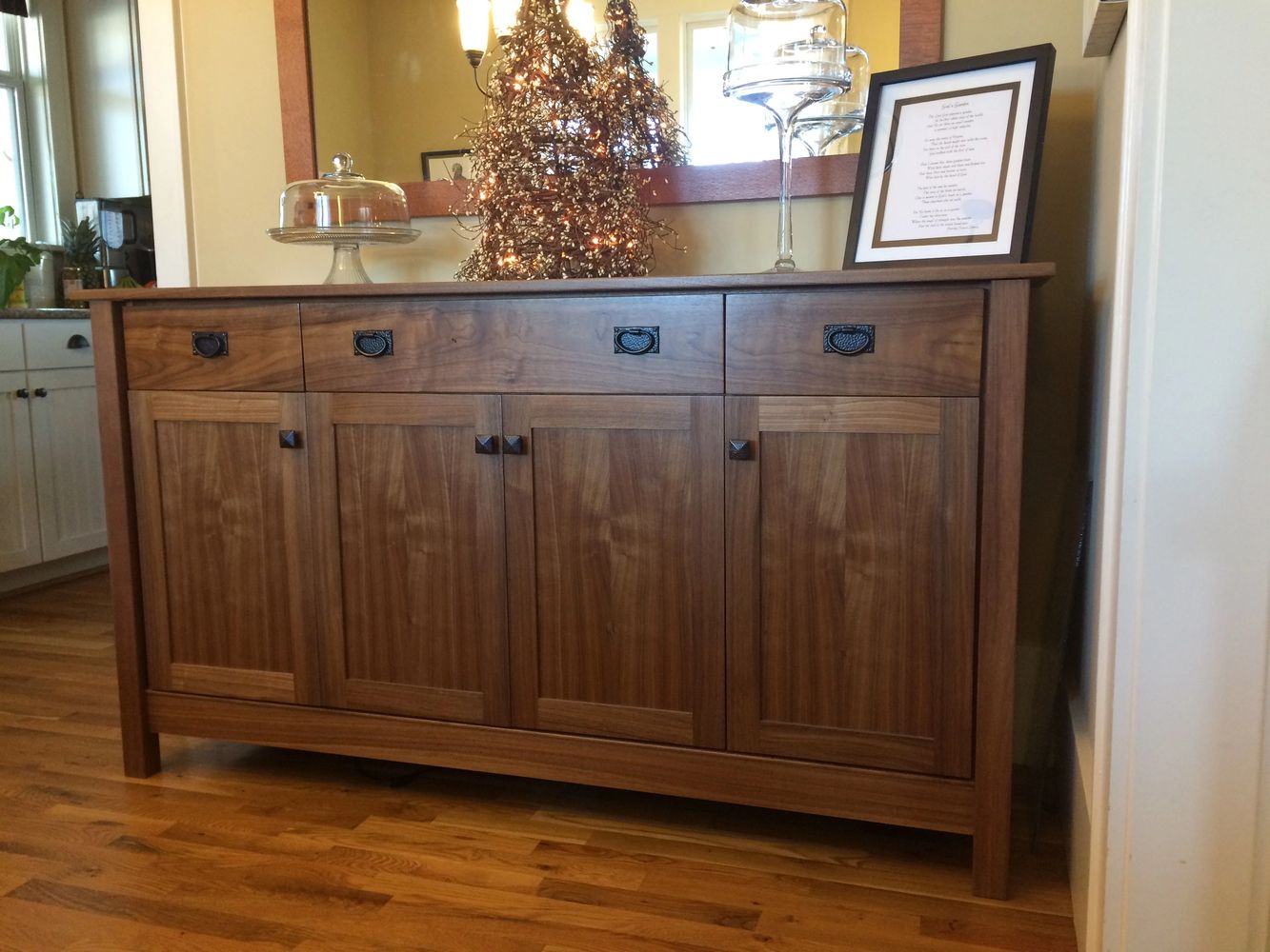 Walnut Buffet with hand-cut dovetailed drawers and soft close drawers and doors.