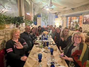 Group of friends dining together at a cozy restaurant.