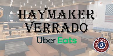 Interior view of Haymaker Verrado restaurant with Uber Eats logo.