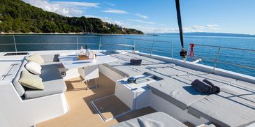 Luxurious yacht deck with comfortable seating and ocean views.