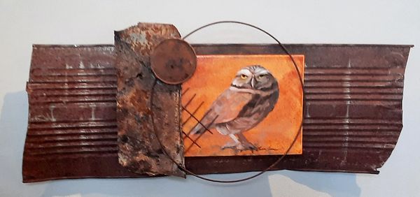 Mixed media artwork featuring an owl on a rusty metal background.