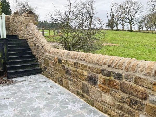 A stone wall built in Northumberland by S.Fairless ltd