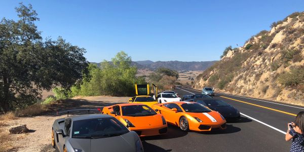 Several Lamborghini cars on a canyon road in Southern California
