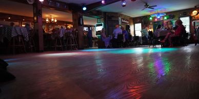 Open dance floor with band getting prepared for a night of great music.