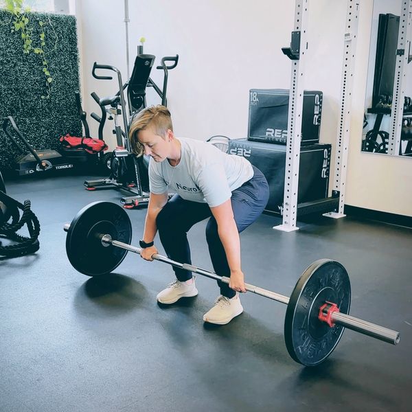 Physical therapy strength training with barbell to improve movement, balance, and recovery in Vancou