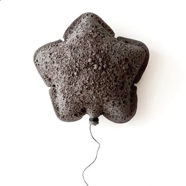 Star-shaped lava rock with a string, resembling a balloon.