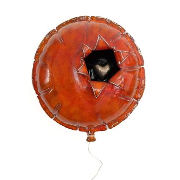 A deflated balloon with a heart inside, symbolizing inner love and healing.