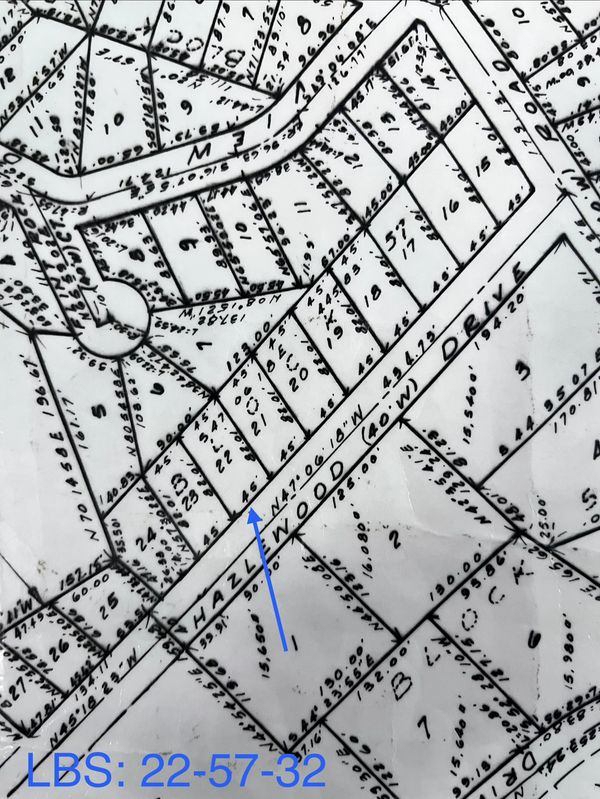 Black and white property map with labeled plots and measurements.