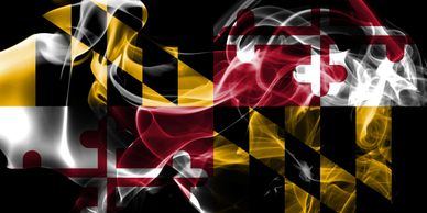 Image of the Maryland State flag. The flag looks artistically projected over smoke.
