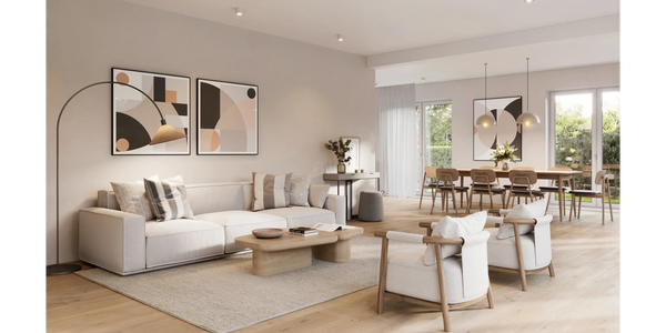 Modern open living and dining area with neutral tones and natural light.