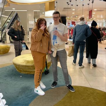the author and partner taking a mirror selfie inside gucci, edinburgh. 