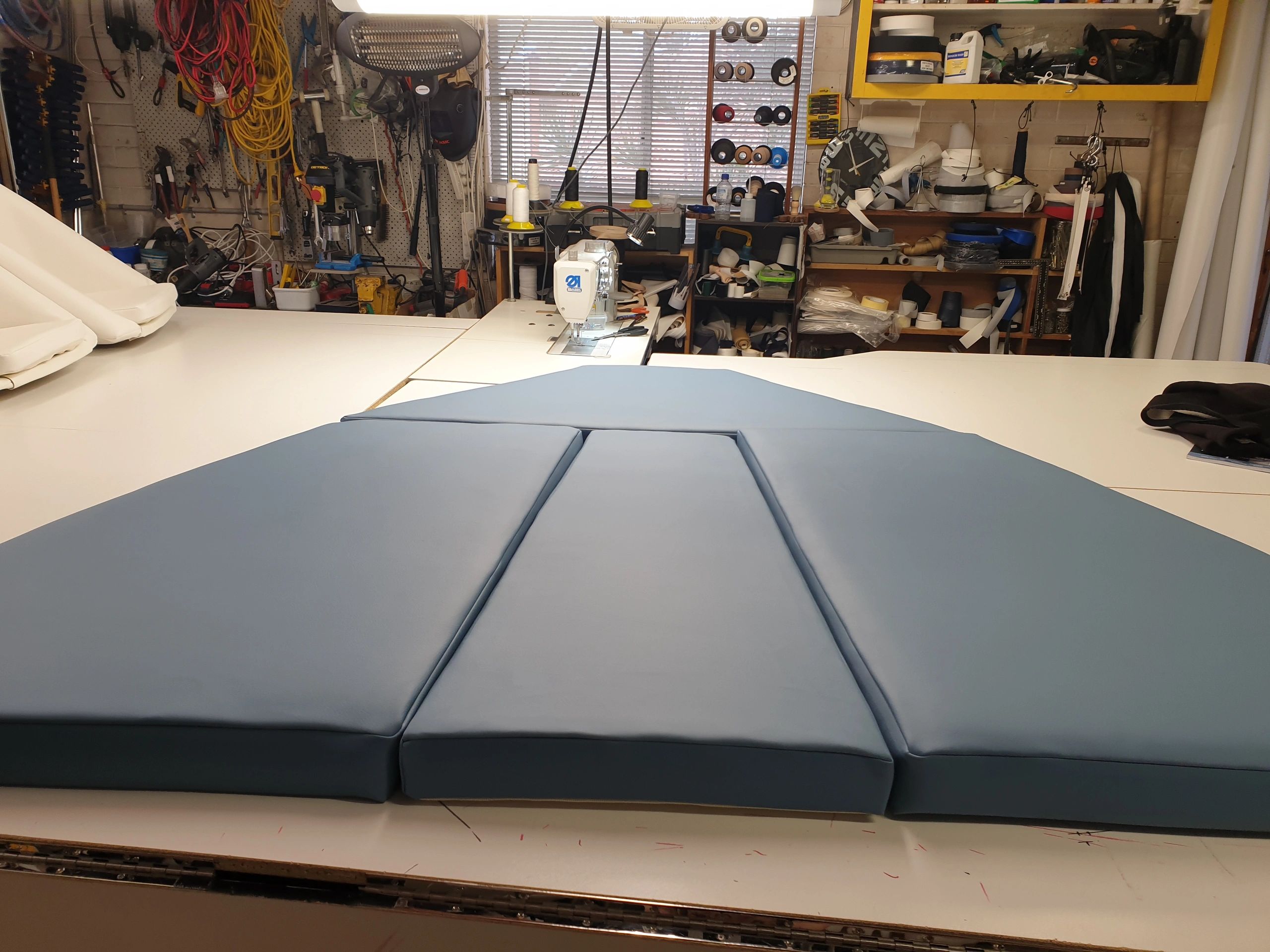 Angled V-berth cushions with 100mm open celled green foam. 