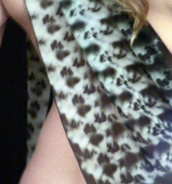 A silk scarf draped over a person's arm 