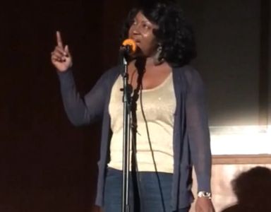 Rev. Karen presenting a spoken word piece at The Pennsylvania Avenue Baptist Church.