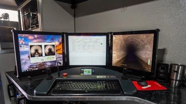 Computer workstation with three monitors