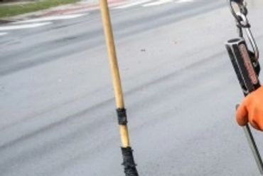 Worker inspecting a manhole