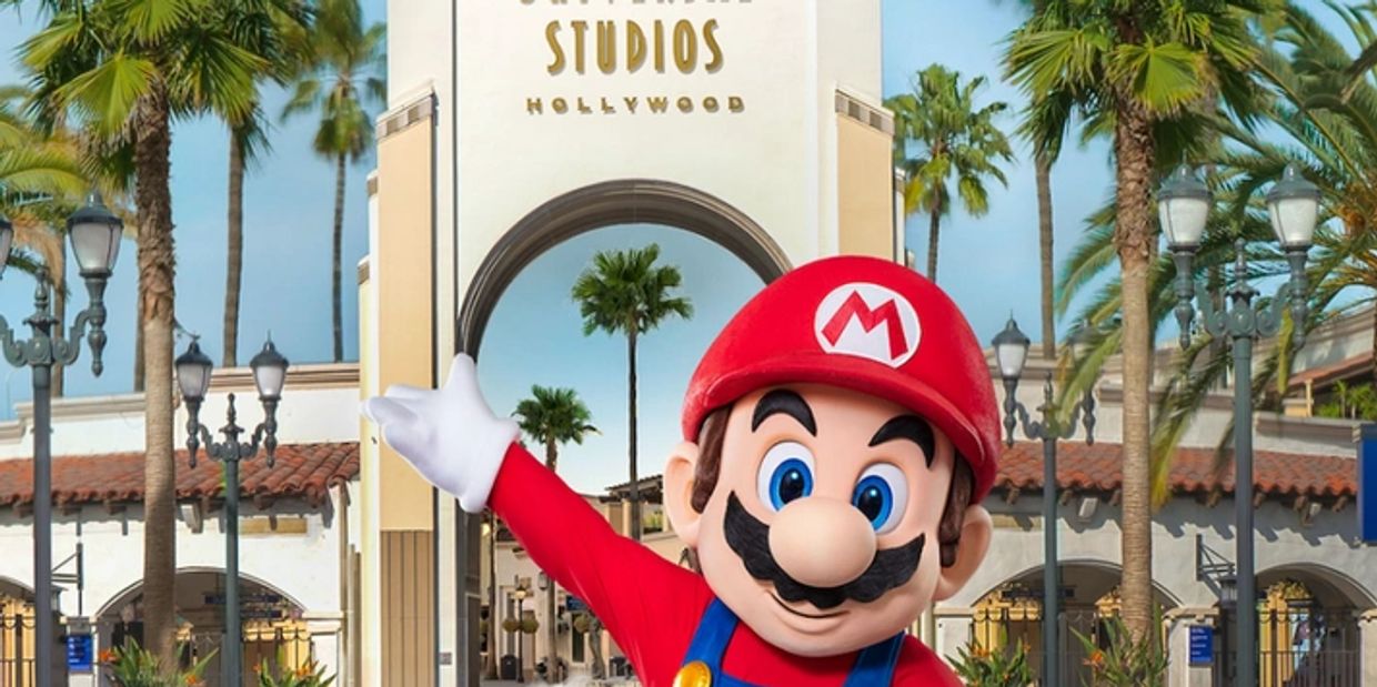 Mario standing front of Universal Studios Hollywood Entrance 