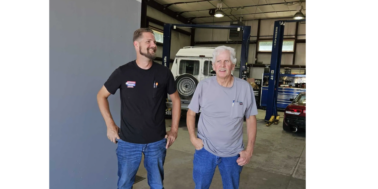 Brandon and Marc standing in the shop