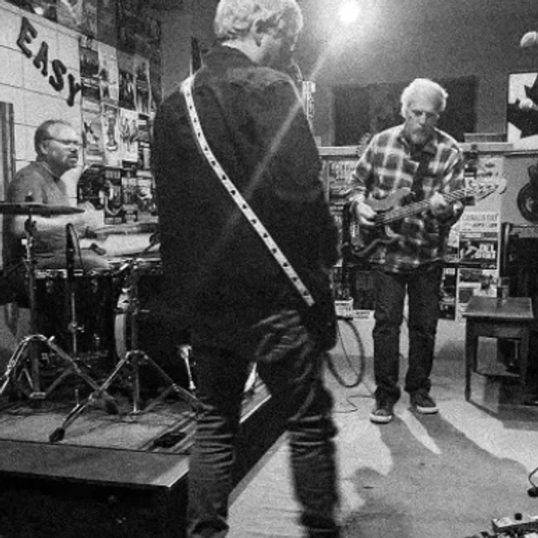 Band performing music in a cozy venue.
