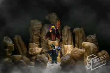 Lego figures facing each other amid towering cereal pieces.