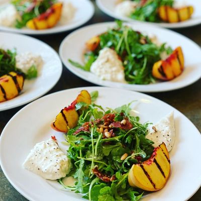 fresh salad with cheese, greens, fruits from our Summer Menu at Yummy Fixins