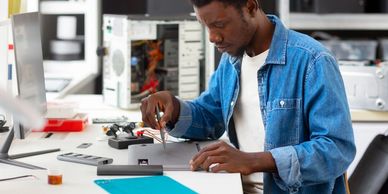 A man working on a laptop.