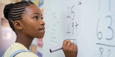 Girl Student on the Board